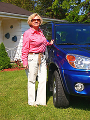 Image showing Lady with blue car                            
