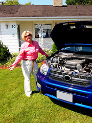 Image showing Lady with blue car                             