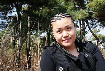 Image showing Beautiful Asian girl with braids