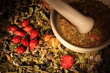 Image showing Mortar and pestle with herbs