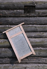 Image showing Washboard on Old Log House Wall