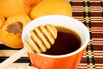 Image showing Honey and fresh apricots