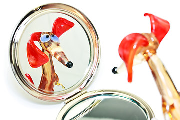 Image showing Glass dachshund looking in the mirror