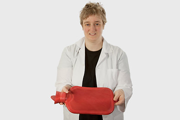 Image showing Lady doctor with hot water bottle