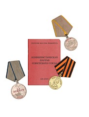 Image showing Soviet communist party membership card surrounded by old medals isolated