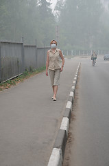 Image showing Woman walking in Heavy Smog