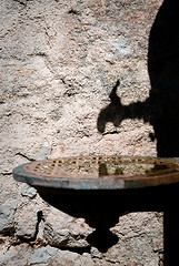 Image showing Shadow of an olld water pump