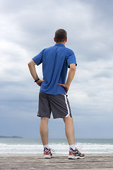 Image showing Runner relaxing on a beach