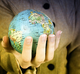 Image showing Globe in a girl's hands