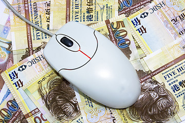 Image showing computer mouse placed on $500 hongkong dollar bills 