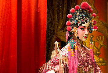 Image showing chinese opera dummy and red cloth as text space 