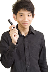 Image showing Young Asian man holding pen