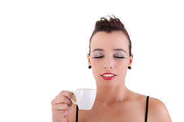 Image showing beautiful young woman, taking and enjoying a coffee