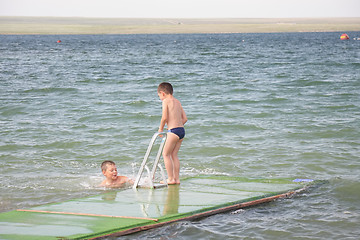 Image showing Boys at sea