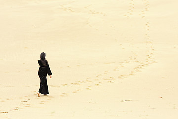 Image showing Woman walking by desert routes