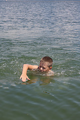 Image showing Boy swimming in sea