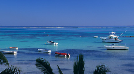 Image showing Blue lagoon at Bain Beauf beach with boats