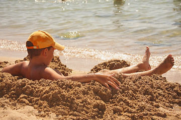 Image showing Boy taking sun-bath