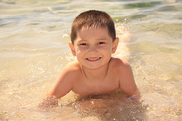 Image showing Smiling boy on seashore