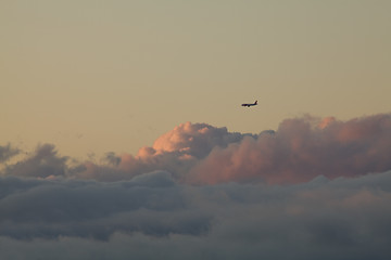 Image showing Plane and low cloud at sunset