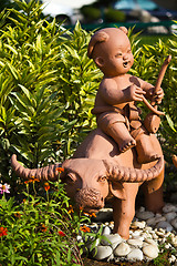 Image showing earthenware childs and buffalo