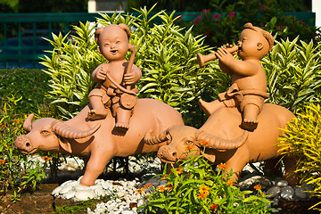 Image showing earthenware childs and buffalo