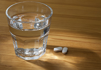 Image showing Glass of Water and Pills.