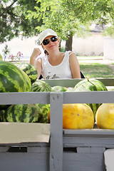 Image showing Street melons vendor at counter