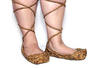 Image showing peasant woman legs in russian bast shoes