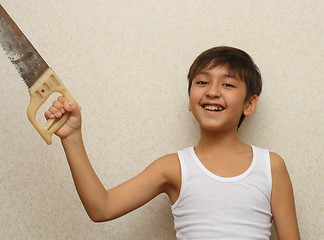 Image showing smiling boy with saw