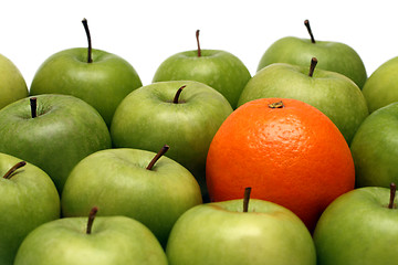 Image showing different concepts - orange between apples