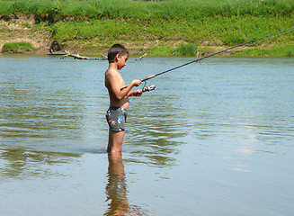 Image showing boy fishing with spinning