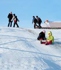 Image showing Children go for a drive from a hill