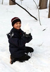 Image showing happy boy with snowball