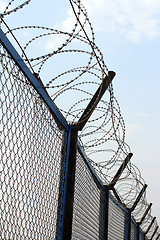 Image showing fence with barbed wire