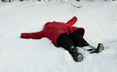 Image showing woman, lying on snow