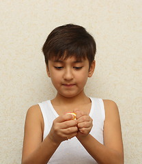 Image showing boy, peeling the orange