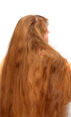 Image showing women combing her long red hair