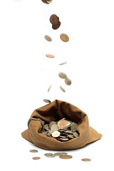 Image showing flying coins, falling in bag