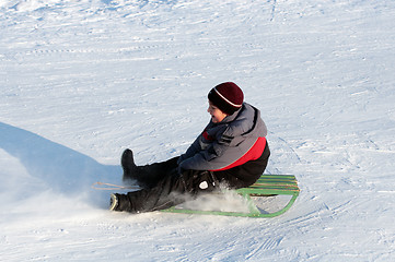 Image showing happy boy on sledge
