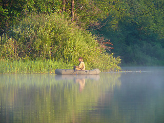 Image showing Fishing men on inflatable rubber dinghy