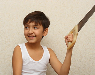 Image showing smiling boy with saw