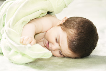 Image showing Cute baby with towel