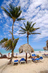 Image showing Sunbeds and parasol