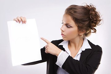 Image showing Beautiful businesswoman with blank paper