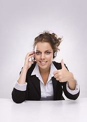 Image showing Pretty young business woman with thumb up