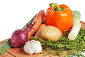 Image showing vegetables on a wooden kitchen board