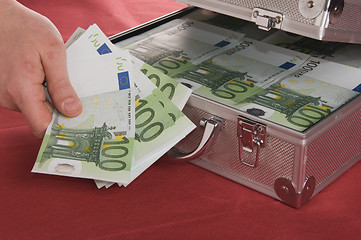 Image showing Metallic case full of Euro