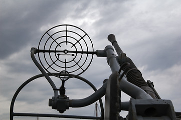 Image showing Kind on the sky through a machine gun sight 