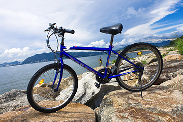 Image showing bike in the sea bay and blue sky